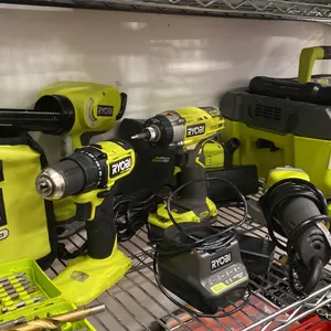 SHELF OF ASSORTED RYOBI TOOLS- DRILLS, GRINDER, PUMP, VACUUM, CHARGERS & MORE