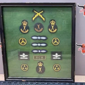Framed Military Badges. 13" x 14".