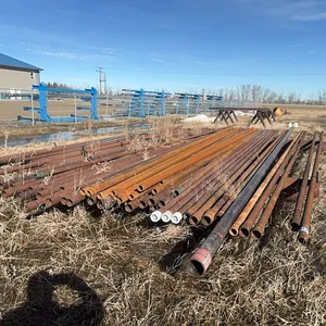 Pipe, Rods & Pipe Racks; (4) 2&3/8, (55) 2&7/8, (9) Fiberglass Rods, (20) 1.25" Sinker Bar