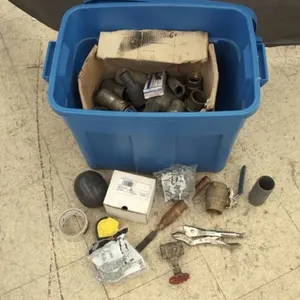 Tote with Assorted Plumbing Supplies