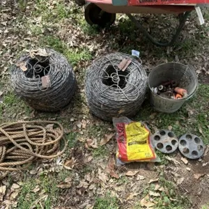 2 rolls of barb wire, fencing supplies, misc.