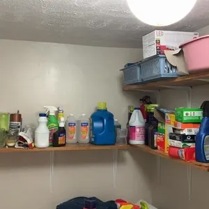 Laundry room shelving contents and laundry basket