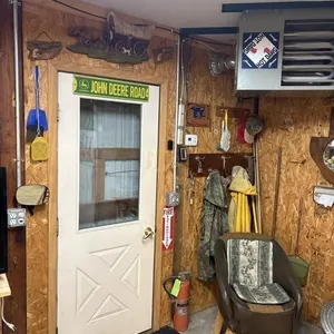 Contents of Corner. JD Sign, D�cor, Chair, Brooms