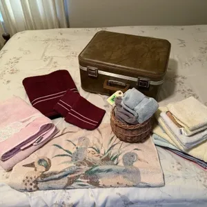 Suitcase, bath towels, hand towels, wash cloths,