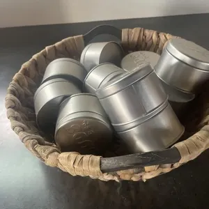 Woven bowl with metal tins empty