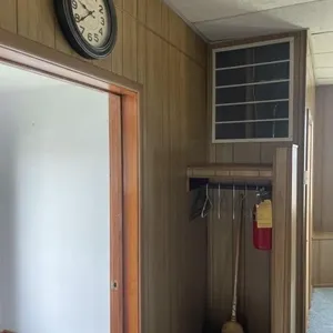 Broom, coat hanger, fire extinguisher, clock