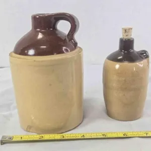 2 Crockery jugs; 6" tall, chipped, stamped USA