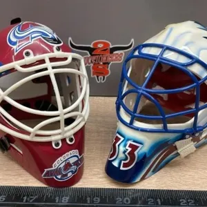 2 NHL Mini Helmets. 1 a little yellowed.