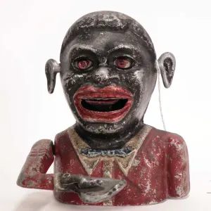 Antique black Americana mechanical money bank, 5 1/2" in height