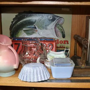 Shelf lot of vintage and antique collectibles including sadiron, one gallon stoneware crock, oil lam
