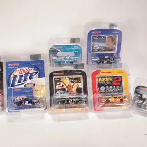 Seven 1: 64 scale Rusty Wallace Action die-cast collectible cars with assorted themes including rock