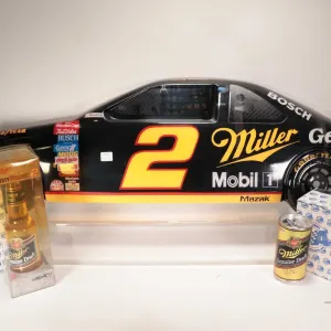 Three Rusty Wallace 1: 64th scale collectibles including Miller Genuine Draft car in bottle, plus ca