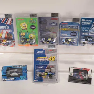 Eight 1: 64 scale die cast collectible cars including Jimmy Johnson 2001-2005 and Jerry Nadeau 2000