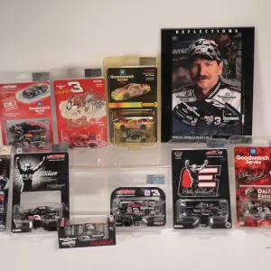 Nine limited edition Action 1: 64 scale Dale Earnhardt collectible cars and a photograph plaque