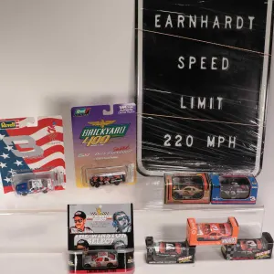 Eight 1:64 scale collectible Dale Earnhardt collectible die cast cars and a metal Earnhardt Speed Li