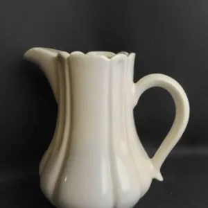 Vintage White Porcelain Pitcher Featuring a Ribbed