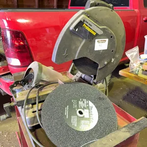 Black and decker professional cut off saw with Makita blades with wheeled work bench