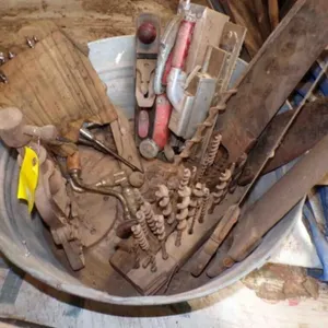 wash tub full of older wood tools