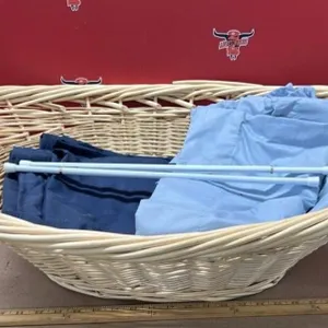 Wicker laundry basket with plastic tablecloths