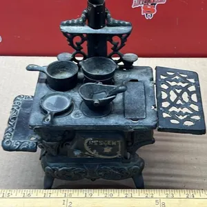 Cast iron miniature stove. 10"W x 5"H