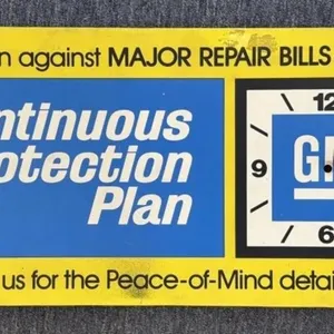 General Motors Thin Plastic Clock Sign on Wood