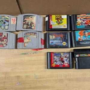 (4) N64 Cartridges, and (6) Sega Genesis Game Cartridges