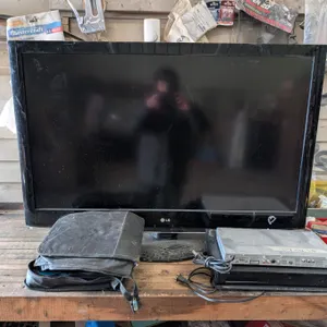 LG TV 45"x51" (not tested) (No Cord) w/ Movies and DVD Players