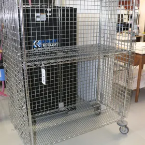 Heavy duty two door, lockable cabinet on castors, one shelf, 68"h x 52"w x 25"d.