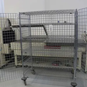 Heavy duty two door, lockable cabinet on castors, four shelves, 68"h x 29"w x 25"d.