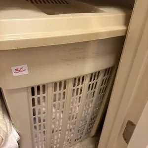 Laundry hamper with two throws