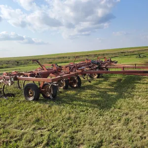Lot 4. 27 foot model 4400 Wilrich chisel plow with harrows, complete walking tandems.