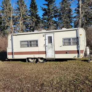 Lot 6. Older style camper, tandem axle, approximately 25’, comes with bill of sale but no title.