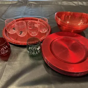 Red chargers, plastic stemless wine glasses,