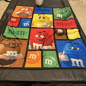 M & M throw blanket, pail included