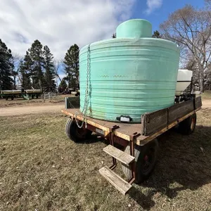 1500 Gallon Poly Tank, Inductor and Pump with Gas Engine on Heavy Duty 4 Wheel Trailer