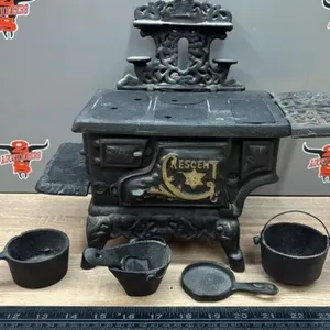 Miniature Crescent Cast Iron Stove. 12”W.