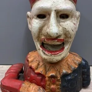 Vintage Humpty Dumpty Cast Iron Coin Bank. Arm