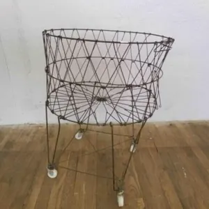 Vintage wire Laundry Cart-has a lean, rolls nicely