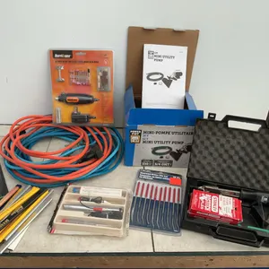 Mini utility pump, quantity of carpenters pencils, extension cords, rotary tool, etc.