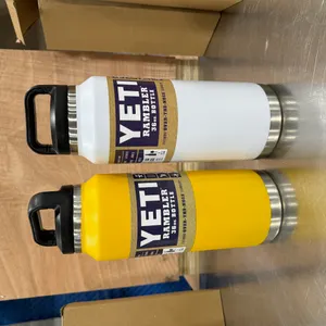 (2) YETI RAMBLER 36 OZ INSULATED BOTTLES - YELLOW & WHITE
