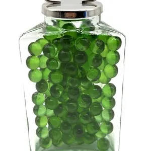 Marbles in Triangular Glass Jar