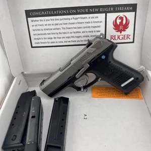 Ruger P95DC 9MM
Box, two extended grip clips and