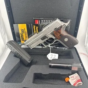 SIG P229 Elite 9MM
Case, one 15 round clip, and