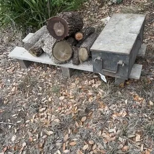 Heavy steel box with drill bits and some oak