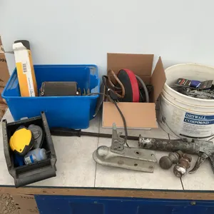 Bucket of screws and miscellaneous, tank heater, trailer balls, chalk line, prybar etc.