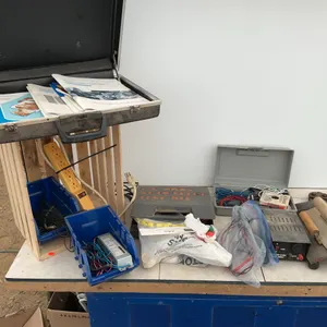 Quantity of electrical wiring pieces, trowels, hatchet, 12 V power supply, bolt cutters etc.