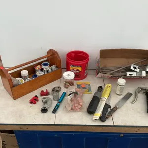 Mini grease gun, tubing cutters, quantity of solder, 12 inch spikes, etc.