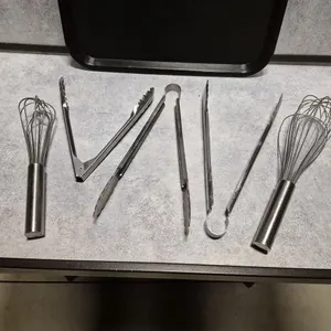 (2) 11" Stainless Steel Tongs, (2) Assorted Whisks, (1) Stainless Steel Utility Tong
