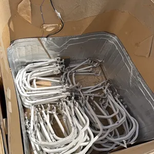 Shipping Box Full of Metal Shelf Hangers