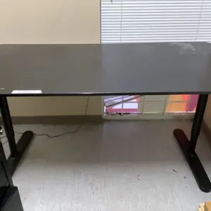 BLACK ADJUSTABLE HEIGHT OFFICE DESK - APPROX. 63" ACROSS X 31 1/2" WIDE